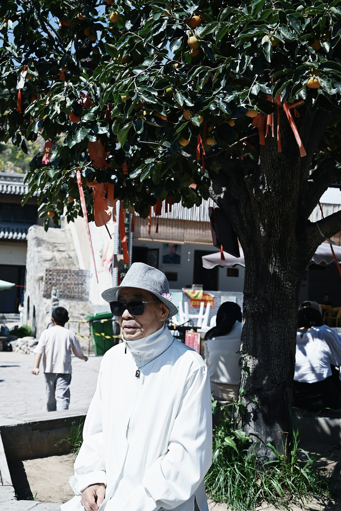 a person standing under a tree