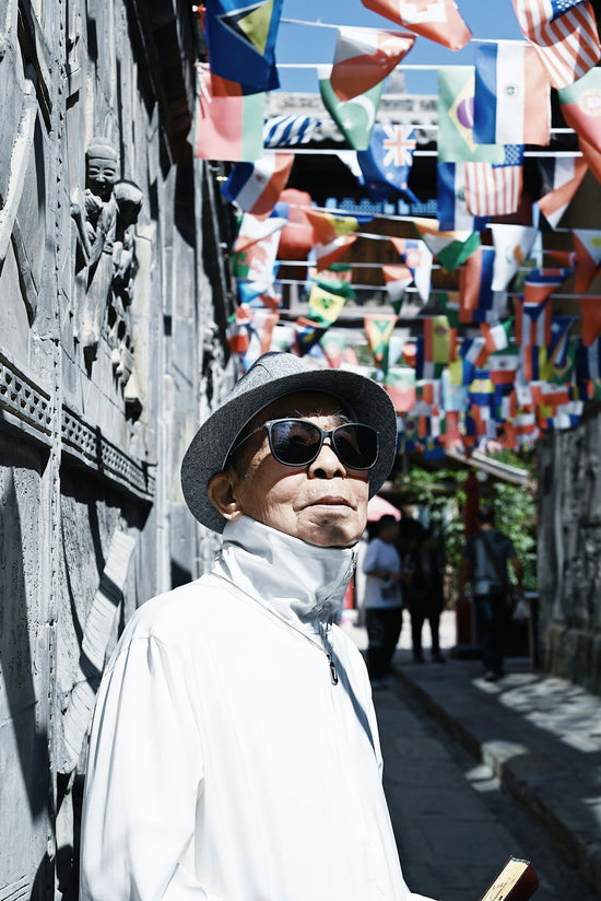 a man wearing sunglasses and a hat