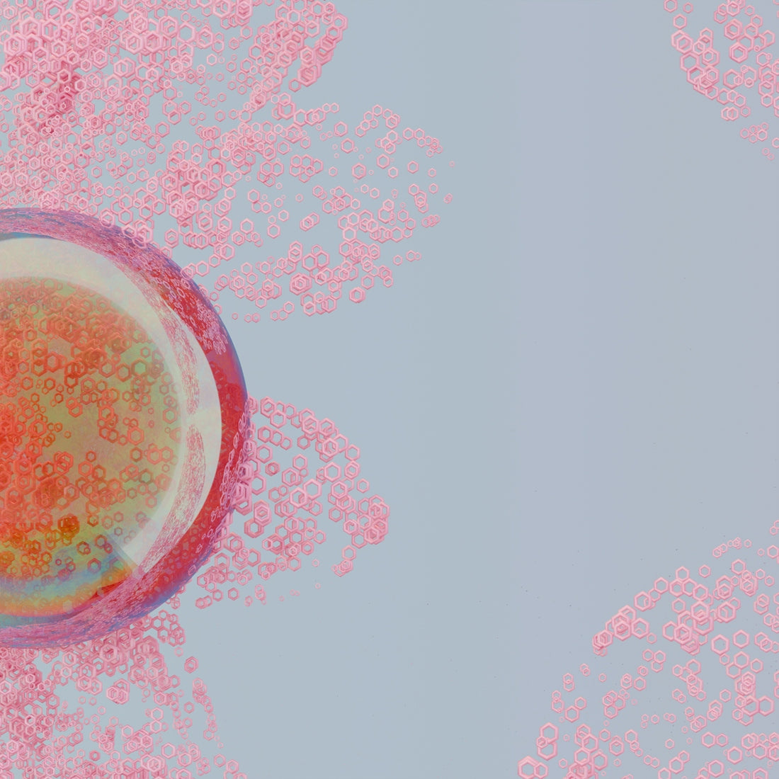 a red and pink substance in a glass of water