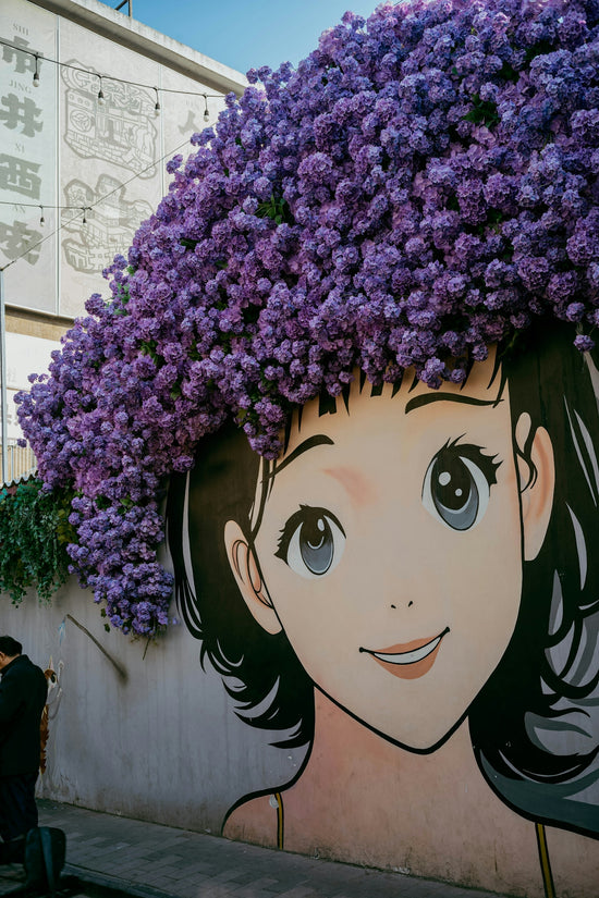 Anime-style mural with a woman wearing a large floral headdress.