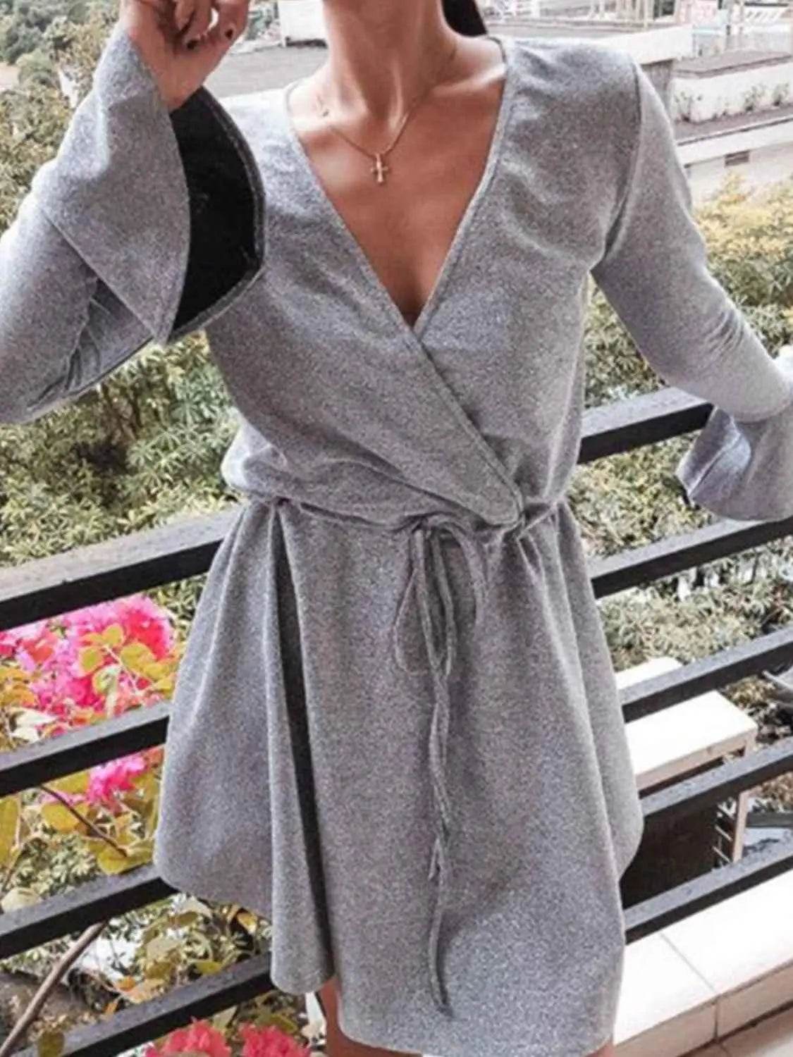 Ivy Lane Plus Size Surplice Neck Flare Sleeve Dress women Attire by Trendsi